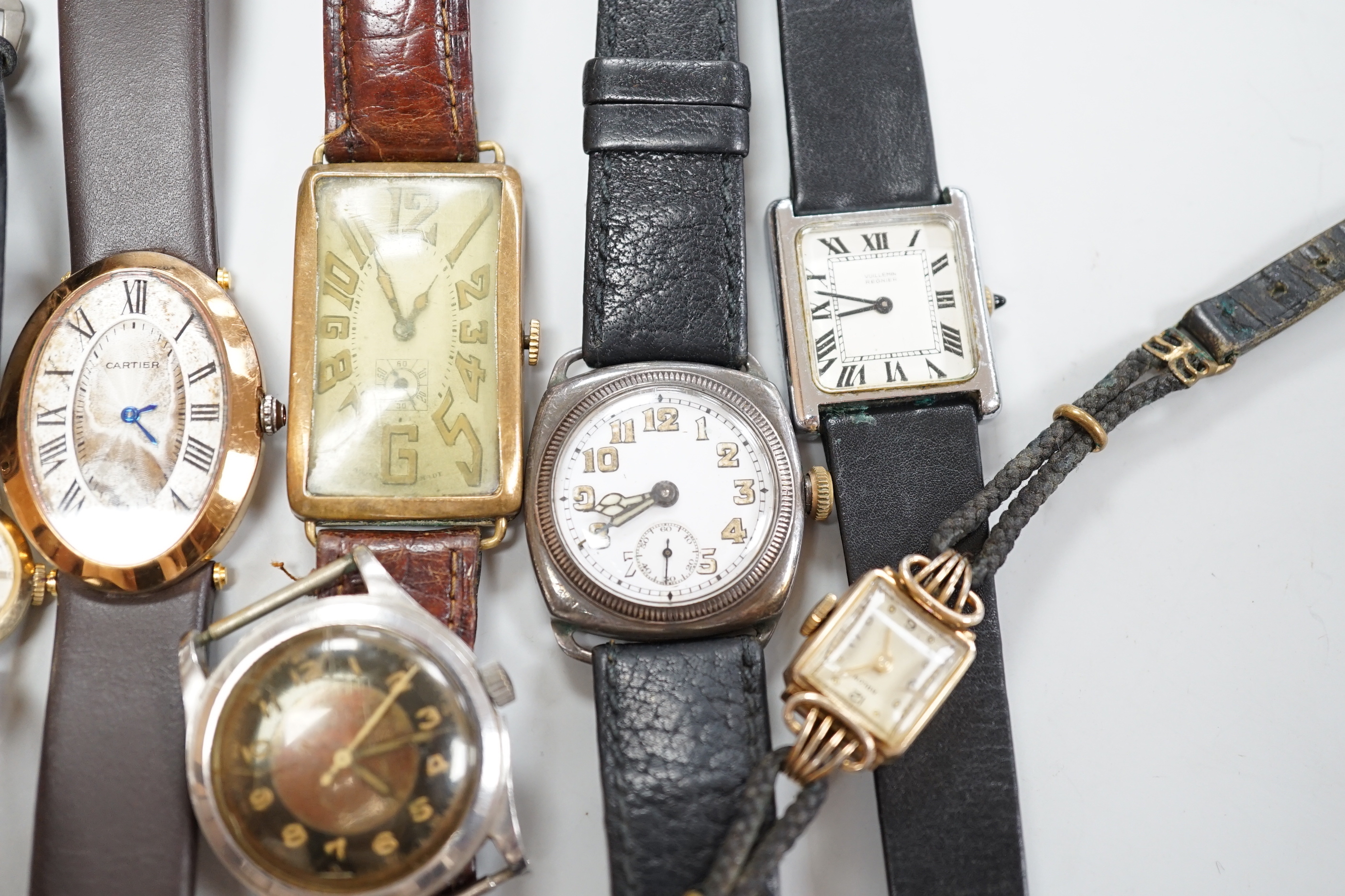 Five gentleman's assorted wrist watches including Swatch and early 20th century white metal and two lady's wrist watches.
